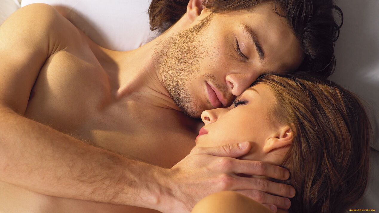 A woman in bed with a man who uses potency-enhancing products